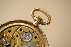 Cartier 18k Gold Pocket Watch, Baguette Ruby Border, c.1925, detail view 22