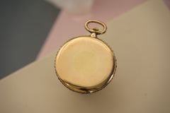 Cartier 18k Gold Pocket Watch, Baguette Ruby Border, c.1925, detail view 4