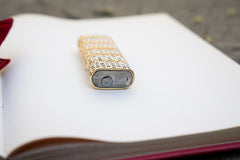 Cartier lighter base plate showing Cartier Paris stamp, PLARGENT marking, serial C69442 and gas valve