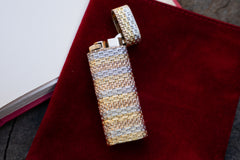 Cartier 18k tri-color gold basket weave lighter, cap open showing mechanism and spark wheel