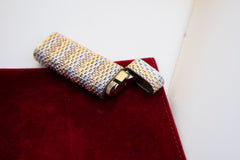 Cartier 18k tri-color gold lighter, detail of basket weave pattern in yellow, white and rose gold