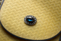 Cartier yellow guilloché enamel étui c.1920, sapphire cabochon and seed pearls, macro