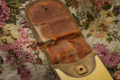 Cartier yellow guilloché enamel étui c.1920, open étui showing the worn silk lining