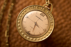 Gold Coin-Form Pendant Watch, 'Time Is Money' Bezel, c.1960, detail view 3
