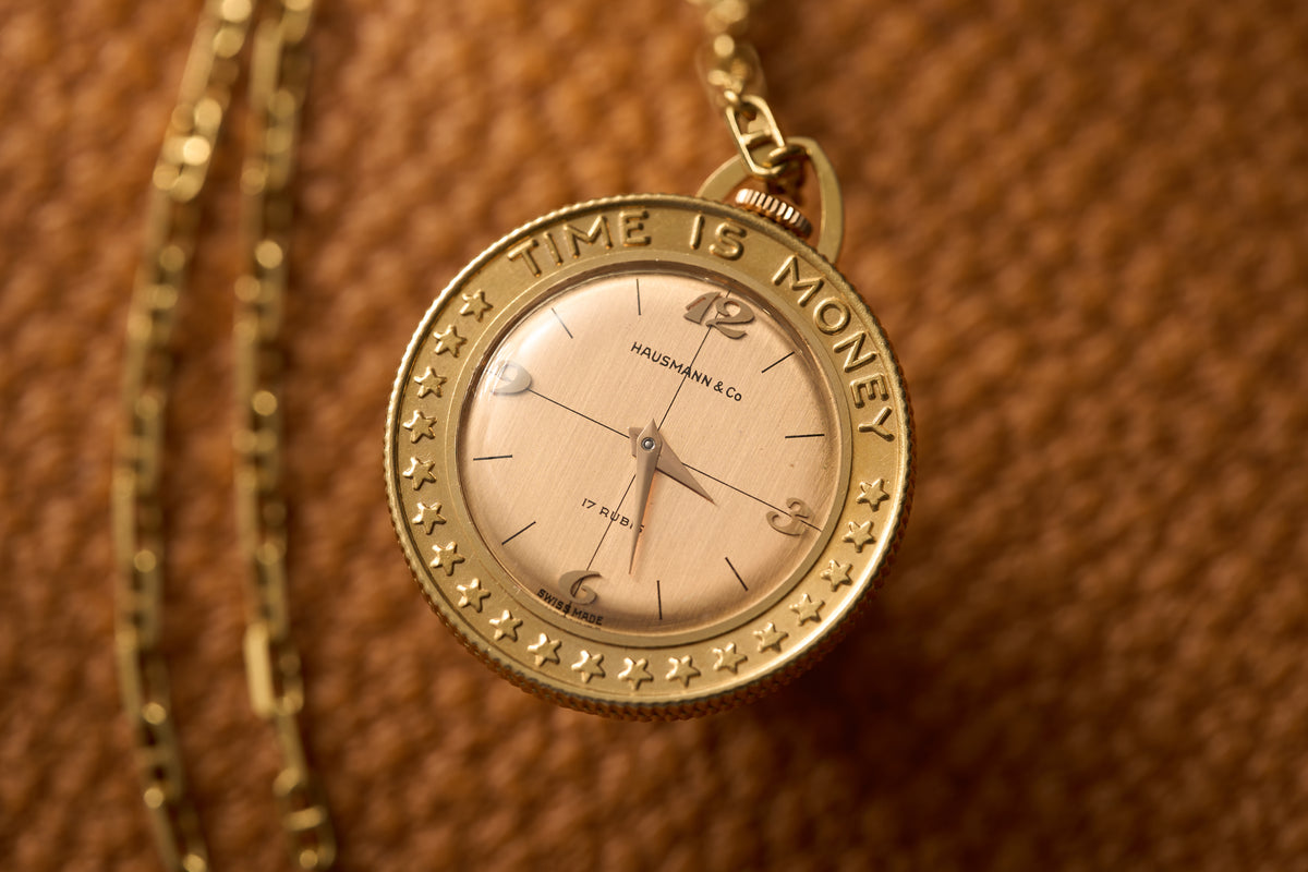 Gold Coin-Form Pendant Watch, 'Time Is Money' Bezel, c.1960, front view