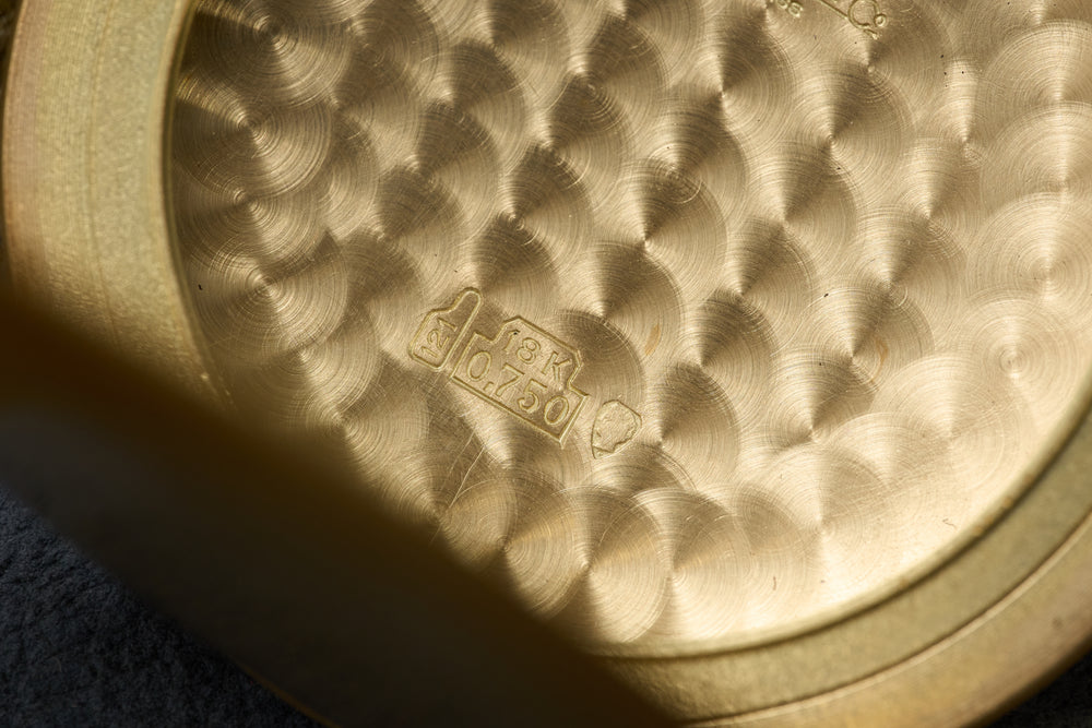 18K 0.750 & Swiss assay