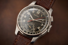 Longines 12.68Z Single-Button Chronograph, Black Dial, 1940s, front three-quarter view, crown and pusher
